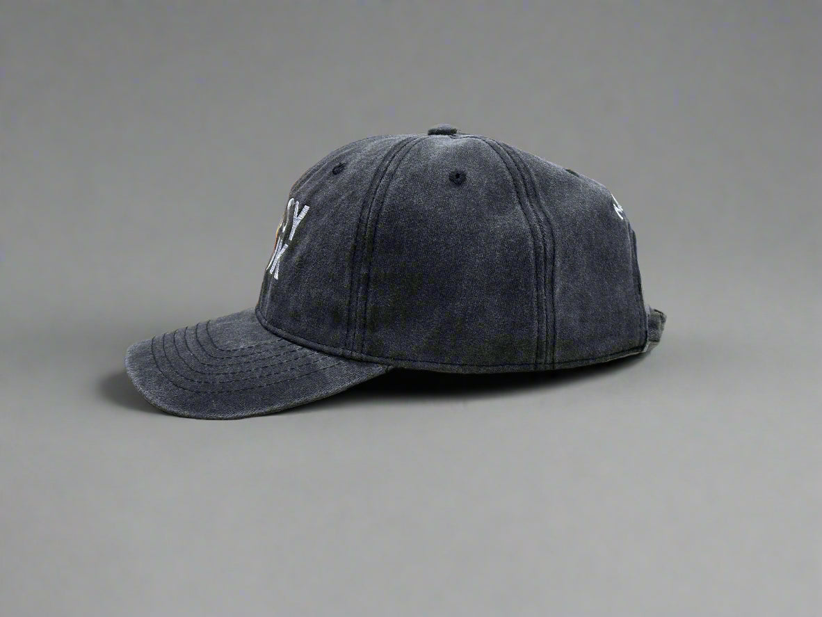 Dark gray baseball cap on a gray background