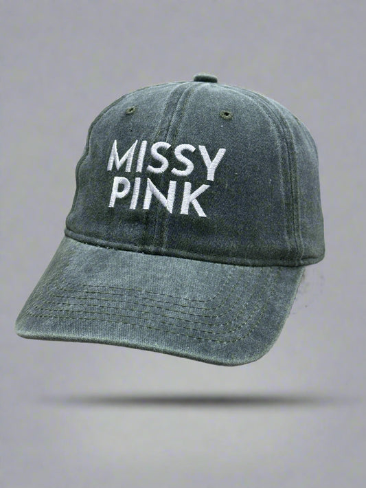 Green cap with 'MISSY PINK' text on a gray background
