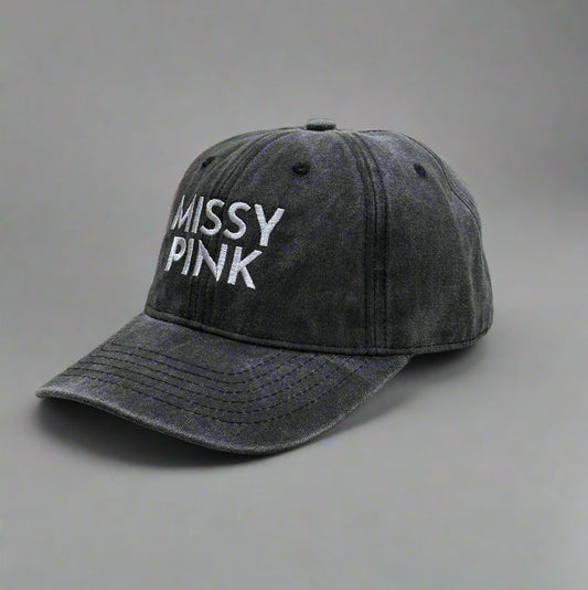 Black Denim cap with 'MISSY PINK' text on a gray background